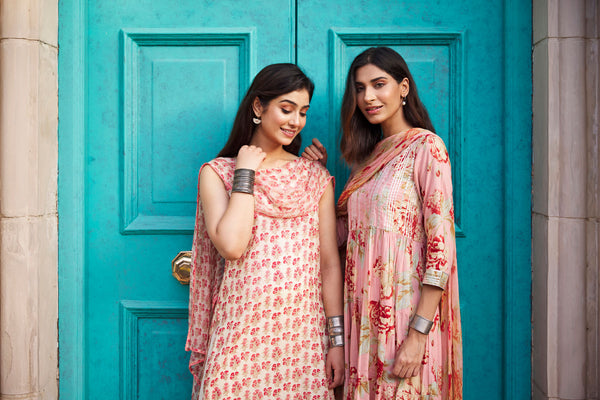 Blending old with new, we bring you the Timeless Fusion Collection.  Rosabelle gathered kurta with beautiful floral print on right, and on left, Fiorelle Kurta is a straight fit sleeveless kurta with an attached chiffon dupatta.